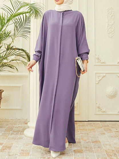 Robe longue musulmane ample à manches chauve-souris, boutonnée, couleur unie, fendue sur les côtés, col rond 