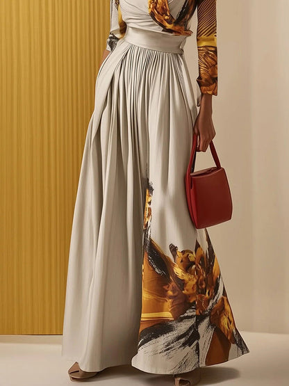 Langärmliger, lockerer Jumpsuit mit Blumenmuster, Plissee und geteiltem V-Ausschnitt 