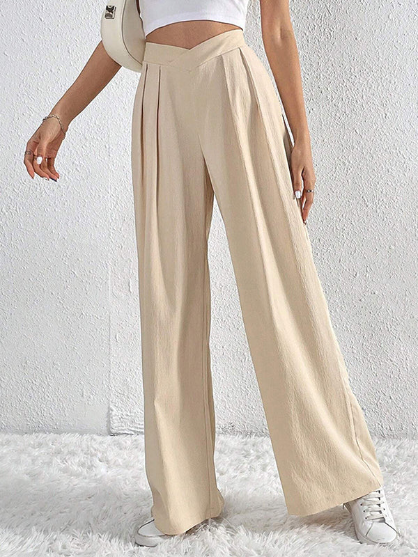 Pantalon ample à jambes larges et plissées de couleur unie 
