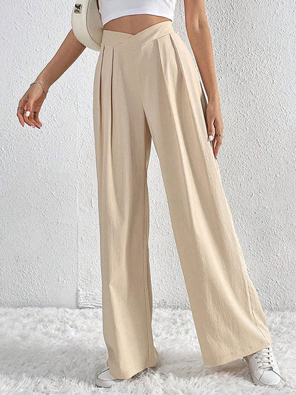 Pantalon ample à jambes larges et plissées de couleur unie 