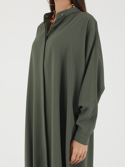 Robe longue musulmane ample à manches chauve-souris, boutonnée, couleur unie, fendue sur les côtés, col rond 