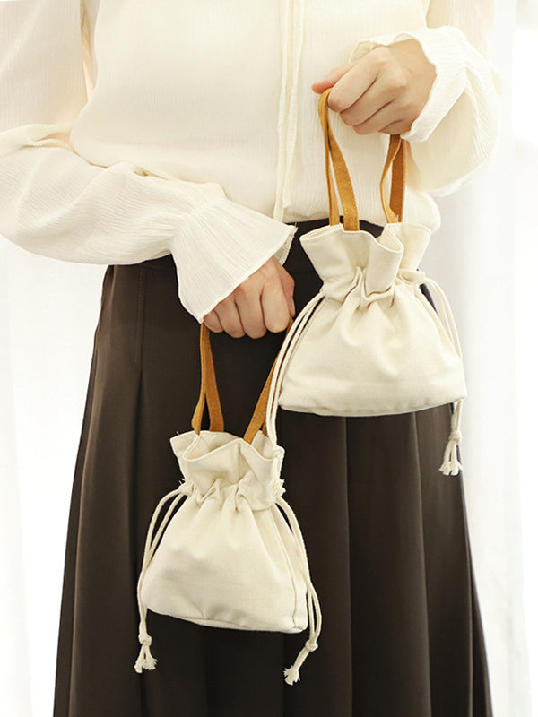 Mini sacs à cordon de serrage et à joint fendu 