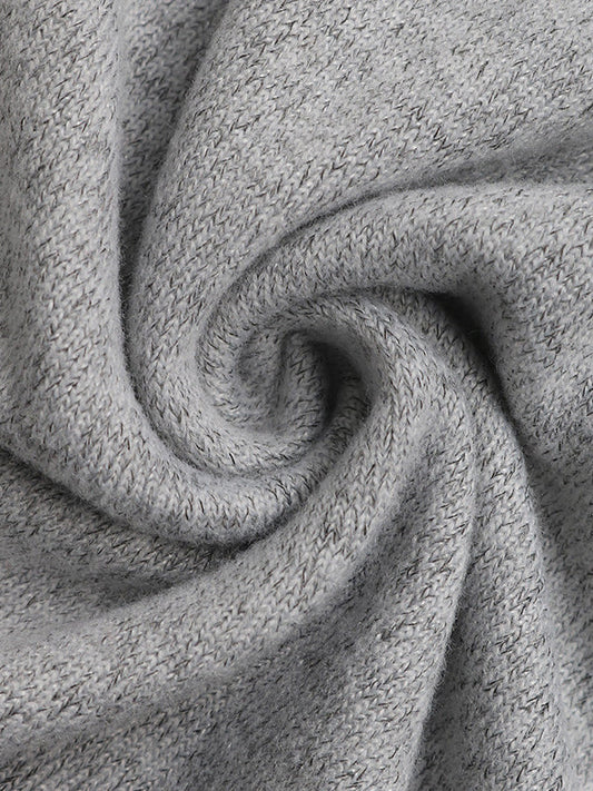 Mini-robe moulante à manches longues et col rond, fendue et pailletée 