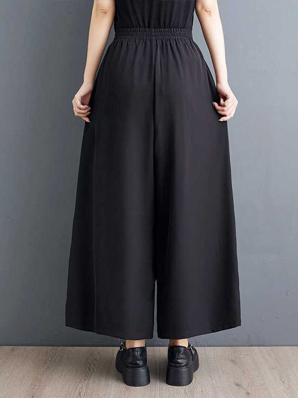 Pantalon culotte taille haute ample à poches plissées et élastiques, avec fermeture éclair et jointure fendue 