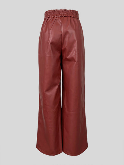 Hose mit hoher Taille, lockeren Faltentaschen und geteilten Beinen 