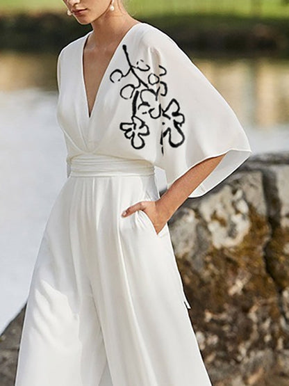 Half Sleeves High Waisted Flower Print Pleated Pockets Deep V-Neck Jumpsuits